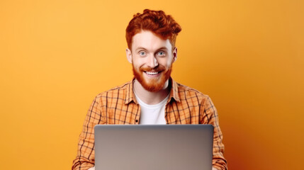 Smiling cheerful smart young ginger man wearing casual teenage clothes using laptop computer pose looking at camera isolated color background - Powered by Adobe