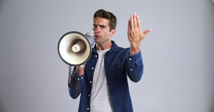 Man, megaphone and announcement, speech and pointing at you to join us in protest, call to action or choice. Portrait, screaming and person on speaker, mockup and broadcast news on a grey background