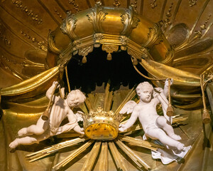 Marble angels among golden baroque decoration in Bratislava cathedral