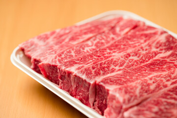 Beef steak in the white plastic container