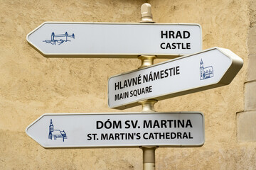 Bratislava tourist sites on direction sign post written in Slovak and English