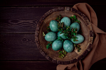 easter eggs, green, marble , boxwood, in a wooden plate, top view, homemade, no people,
