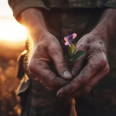 Fotobehang Soldier's hands holding a flower. Generative AI © Yan Gordiza