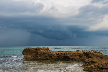 Rocky Beach with Cloudy Sky: Cap Serrat's Coastal Beauty in Bizerte, Tunisia