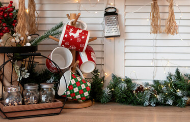 Red cups on the festive table at home. Christmas concept, New Year celebration