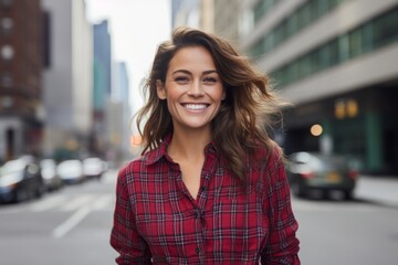 Portrait of a cheerful woman in her 30s wearing a comfy flannel shirt against a bustling city street background. AI Generation