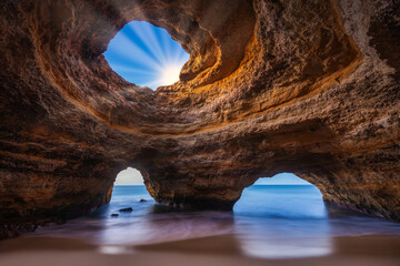  Spectacular sunset view of the Benagil Sea Cave in Algarve, Portugal, Europe