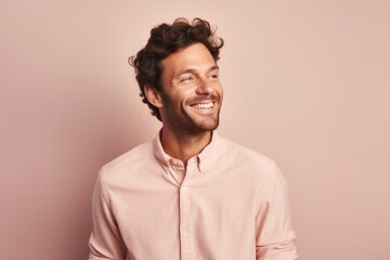 Fototapeta premium Portrait of a happy man in his 30s dressed in a warm wool sweater against a pastel or soft colors background. AI Generation
