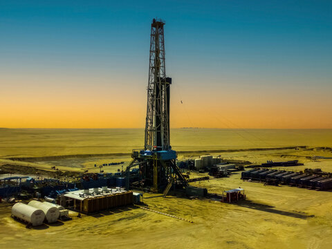Oil drilling rig at sunset in the Saudi Arabia