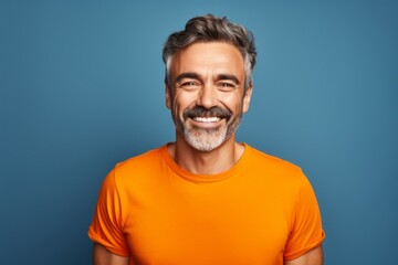 Obraz premium Portrait of a smiling man in his 40s donning a trendy cropped top against a solid color backdrop. AI Generation