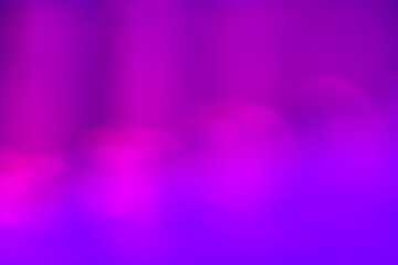 Pastel color gradient bokeh background on purple background.