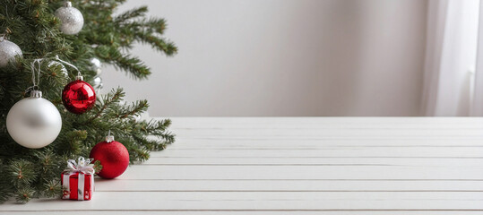 Fototapeta na wymiar Christmas tree and christmas ornament above white wooden table