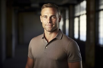 Fototapeta premium Portrait of a grinning man in his 30s wearing a breathable golf polo against a empty modern loft background. AI Generation