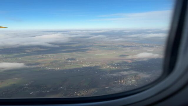 View from airplane landing in Modlin Airport in Poland in November. Vertical video