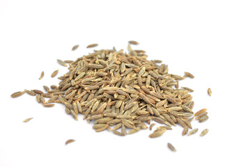 Pile of cumin seeds on white background