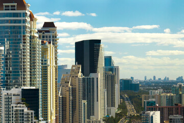 Obraz premium Aerial view of Sunny Isles Beach city with luxurious highrise hotels and condos on Atlantic ocean shore. American tourism infrastructure in southern Florida