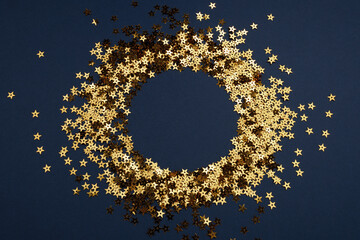 Round gold frame or border of random scatter golden stars