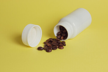 Dropped Many roasted coffee beans in a glass, in bucket jar
