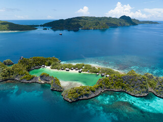 Idyllic Rufas Island, near Penemu in Raja Ampat, is surrounded by healthy corals and open ocean. This island, as well as those in the region, support some of the highest marine biodiversity on Earth.