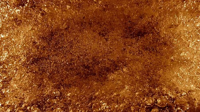 Top Down Full Frame Slow Motion Golden Beer Bubble Particle Loop Background