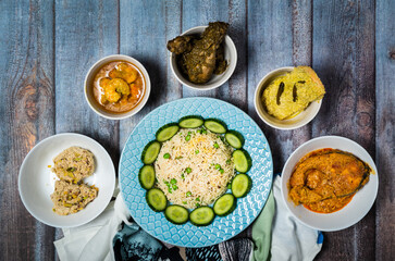 Assorted indian food decoration on the dark wooden background. Dishes and appetizers of indian cuisine.
