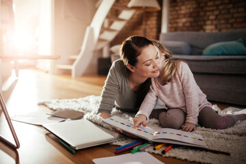 Mother and Daughter Enjoying Coloring Time Together at Home