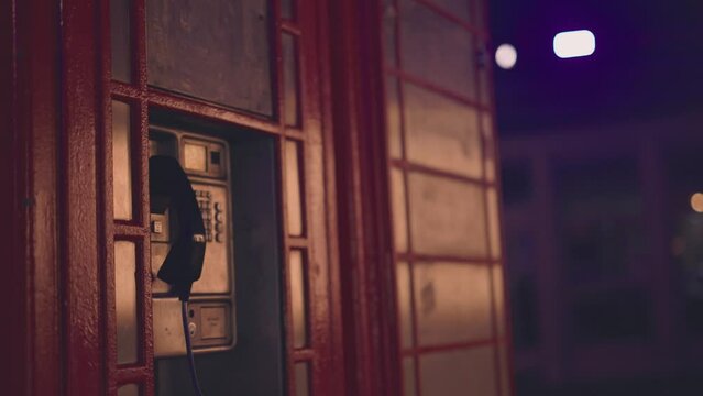 Public payphone in street at night