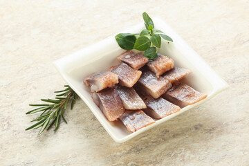 Delicous sliced herring fillet in grape sauce