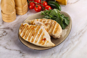 Grilled chicken breast served arugula