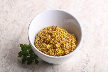 Grain mustard sauce in the bowl