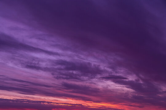 Beautiful sunrise, sunset violet purple orange sky with clouds abstract background texture