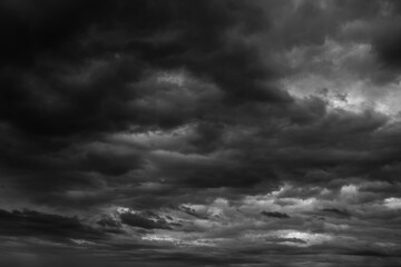 Storm sky with dark grey  black clouds  abstract background texture, thunderstorm. Black and white...