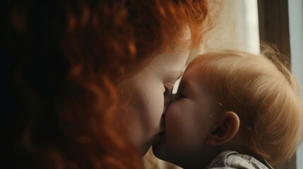 Redhead Irish mother kisses and hugs her baby, blurred kids room - obrazy, fototapety, plakaty