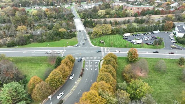 Drone footage of the cars driving on Prince Rodgers Aveat sunset in Bridgewater, New Jersey, USA