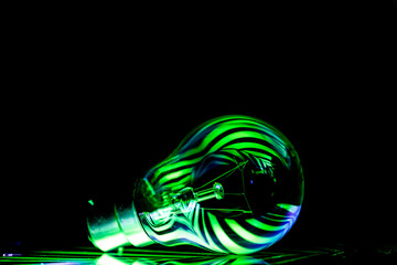 "Vibrant multi-colored lights illuminate a light bulb, perfect for adding brightness and creativity to your projects. 