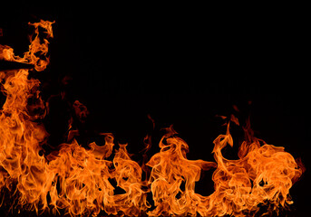 fire flame background banner.play of flames on a dark background.real flames for background