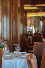 Art Deco interior design style furniture, carpets and paneling onboard classic ocean liner cruiseship cruise ship main dining room restaurant