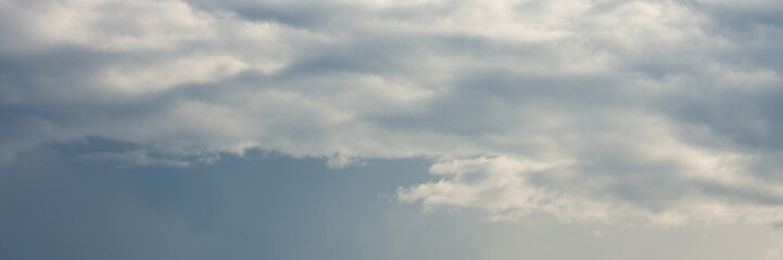 Obraz premium Beautiful sky background with clouds. Scenic cloudscape. Wide panoramic background for design.