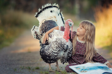 Girl with long hair on dress with turkey bird on countryside at sunset - obrazy, fototapety, plakaty