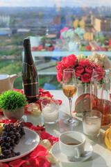 Served festive table with wine, fruits and glasses
