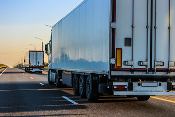 Trucks moving along a country highway