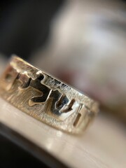 golden Ring with hebrew letters Text Jerusalem