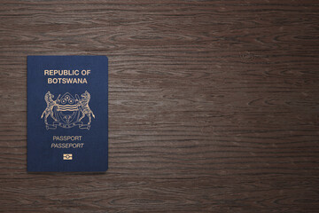 Botswana passport on wooden background, top view