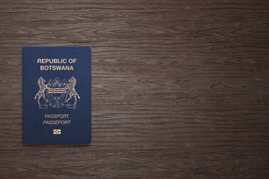 Botswana passport on wooden background, top view