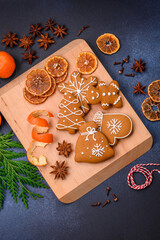 Beautiful festive Christmas composition of tangerines, gingerbread and star anise