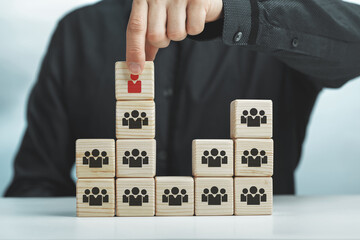 Assembled wooden cubes on the theme of business leadership