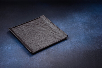 Round empty colored ceramic plate on concrete texture background