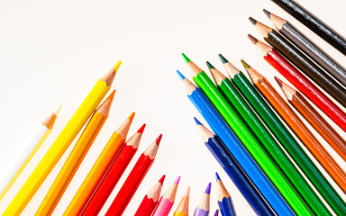 A Vibrant Spectrum of Colored Pencils in a Harmonious Arrangement. A group of colored pencils sitting next to each other