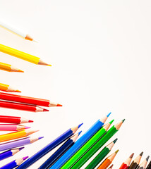 A Vibrant Array of Colorful Pencils in a Neat Row. A row of colored pencils sitting next to each other