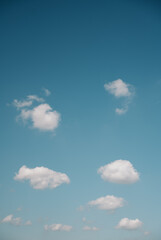 fluffy clouds in the turquoise sky